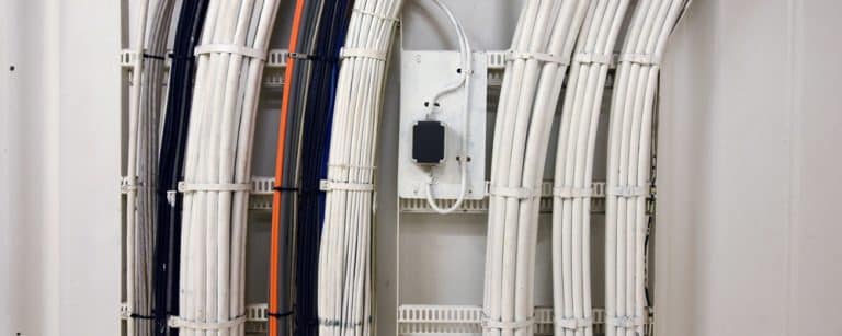 A,Complex,Network,Of,Cables,And,Wires,Running,Along,A